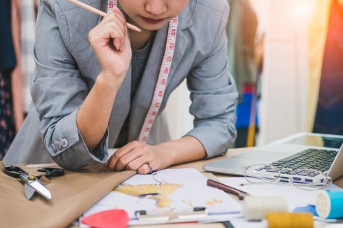 Stock Photo Attractive Female Fashion Designer Work Hard In Home Office